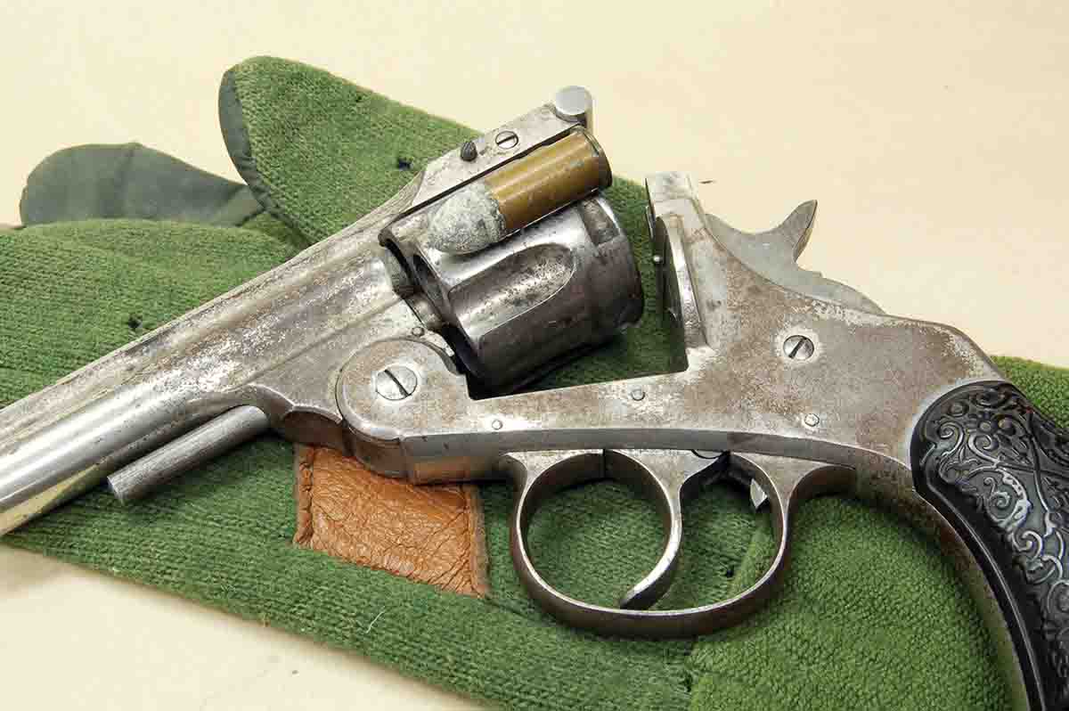 Even though the gun is unmarked, the cylinder length shows it is intended for the .38 Short Colt.